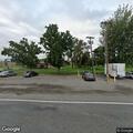Person slumped over in vehicle at golf course