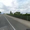 Man walking on Lee Blvd removing his clothes