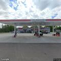 Vehicle hits parked pickup and leaves gas station