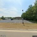 Bushes on fire next to building on Industrial Park Road