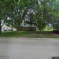 Woman checks playground boxes and garage, then leaves