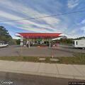 Vehicle hits gas station building, no injuries