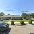 Person taking photos at vacant house for sale