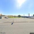 Person unresponsive in running car near bus garage