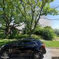 Pickup blocking driveway on East 6th Street