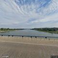 Woman walking in traffic on Memorial Bridge
