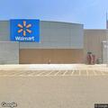 Woman hits pole in parking lot, injures arm