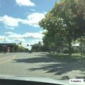 Man lying under bike on sidewalk possibly intoxicated