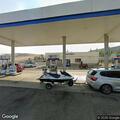 Person found unconscious at gas station on Main Street