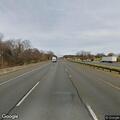 Pickup with dog chained in truck bed on I-270