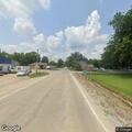 Vehicle with blown tire blocking part of roadway