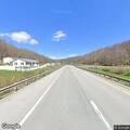 Car facing wrong direction along Route 33 shoulder