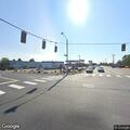 Man walking in and out of traffic at street intersection