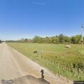 Dirt bike speeding past driveway in Shevlin