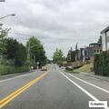 Man walking around house near garage on Lakeview