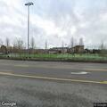 Person found under blanket on park bench at sports field