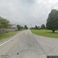 Car stopped in roadway without hazard lights