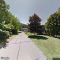 Tree and wires block West High Street roadway