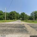 Power lines down across driveway on 4th Street