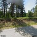 Wind-driven brush fire near barn at Shore Acres