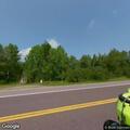 Vehicle in ditch, driver reports back pain
