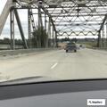 Car leaves roadway near Stillaguamish River bridge