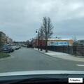 Man yelling and waving hands in street
