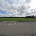 Person slumped over in vehicle at park entrance
