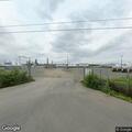 Person experiencing abdominal pain at refinery
