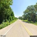 Tree on power line causing roadside fire