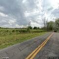 Man walking along roadway on Hamburg Road