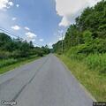 Car parked in crosswalk near Rural Valley church