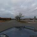 Officer conducts traffic stop on blue SUV