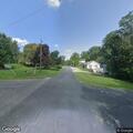 Male lying in roadway on Washington St in Burlington