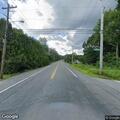 Deer struck by car blocking roadway