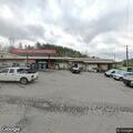 Vehicle blocking road near store on Cane River Road