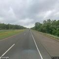 Single-car rollover crash blocks guardrail on highway