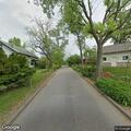 Person experiencing abdominal pain near Brown Elm Avenue