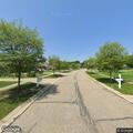 Suspicious person near creek with bucket and mower