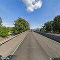 Pedestrian walking along Interstate 5 in Medford