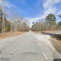 Tree about to fall onto roadway on Water Tank Road