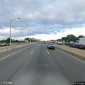 female experiencing abdominal pain on expressway
