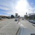 Person with back pain at gas station in Glendora