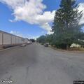 Person suffering from back pain at intersection in Columbia Falls