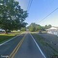 Tree down with power lines blocking lane on Midway Road