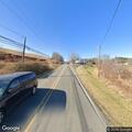 Pedestrian standing in roadway on Beaver Creek Road