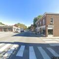 Person in wheelchair blocking traffic on Main Street