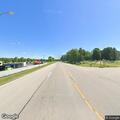 Goose blocking traffic on highway intersection