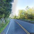 Small building fully engulfed on Route 107