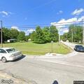 Dog reported under pavilion at baseball field